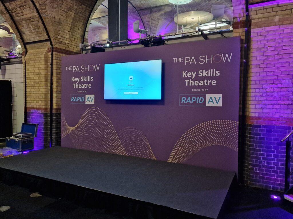 Branded seminar stage with screen